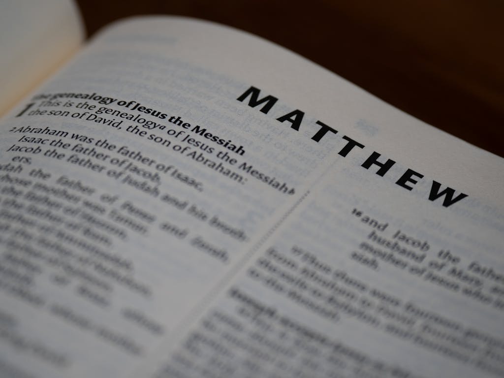 Close-up of the Book of Matthew in an open Bible with selective focus.